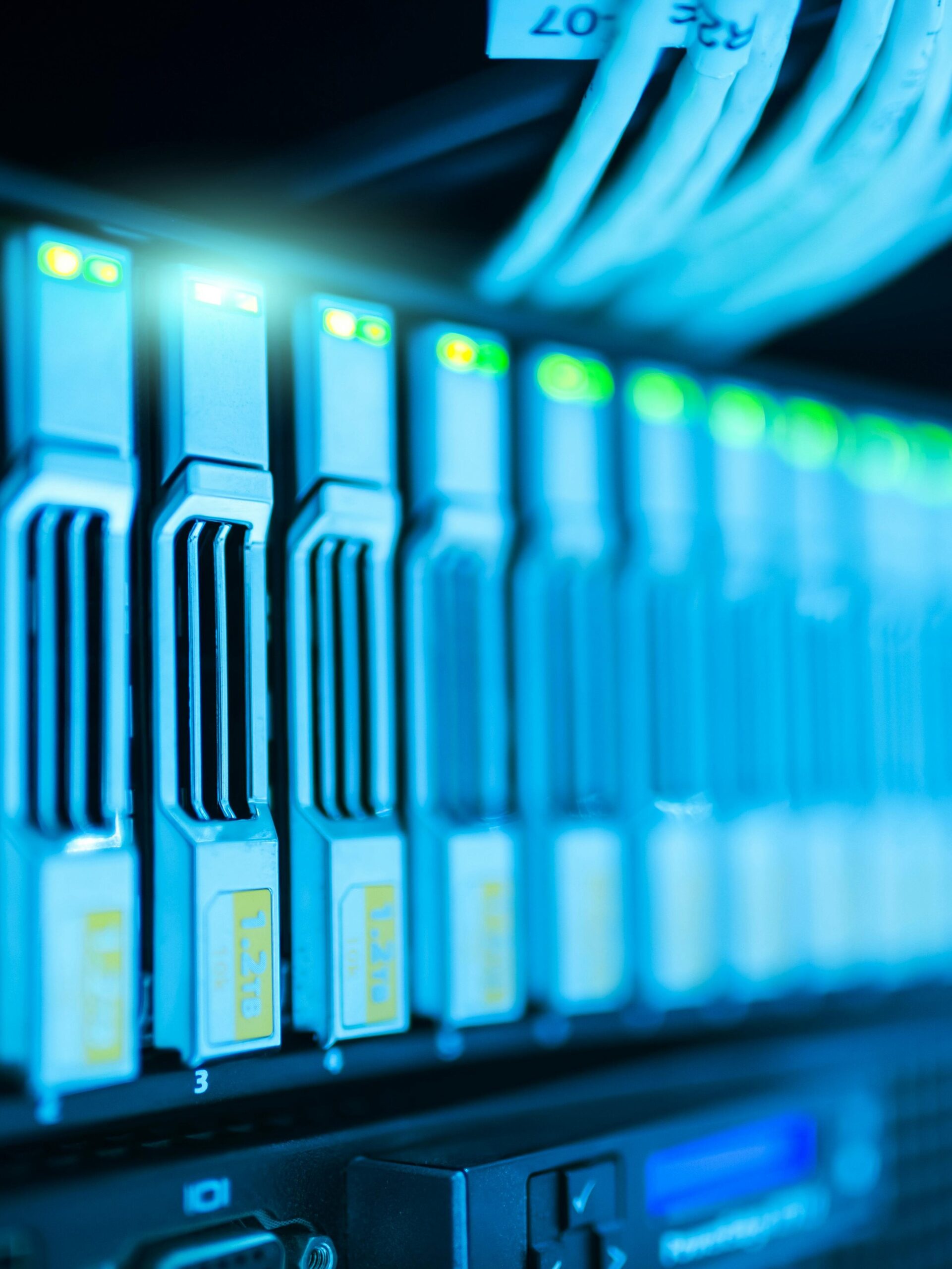 Detailed image of a server rack with glowing lights in a modern data center.