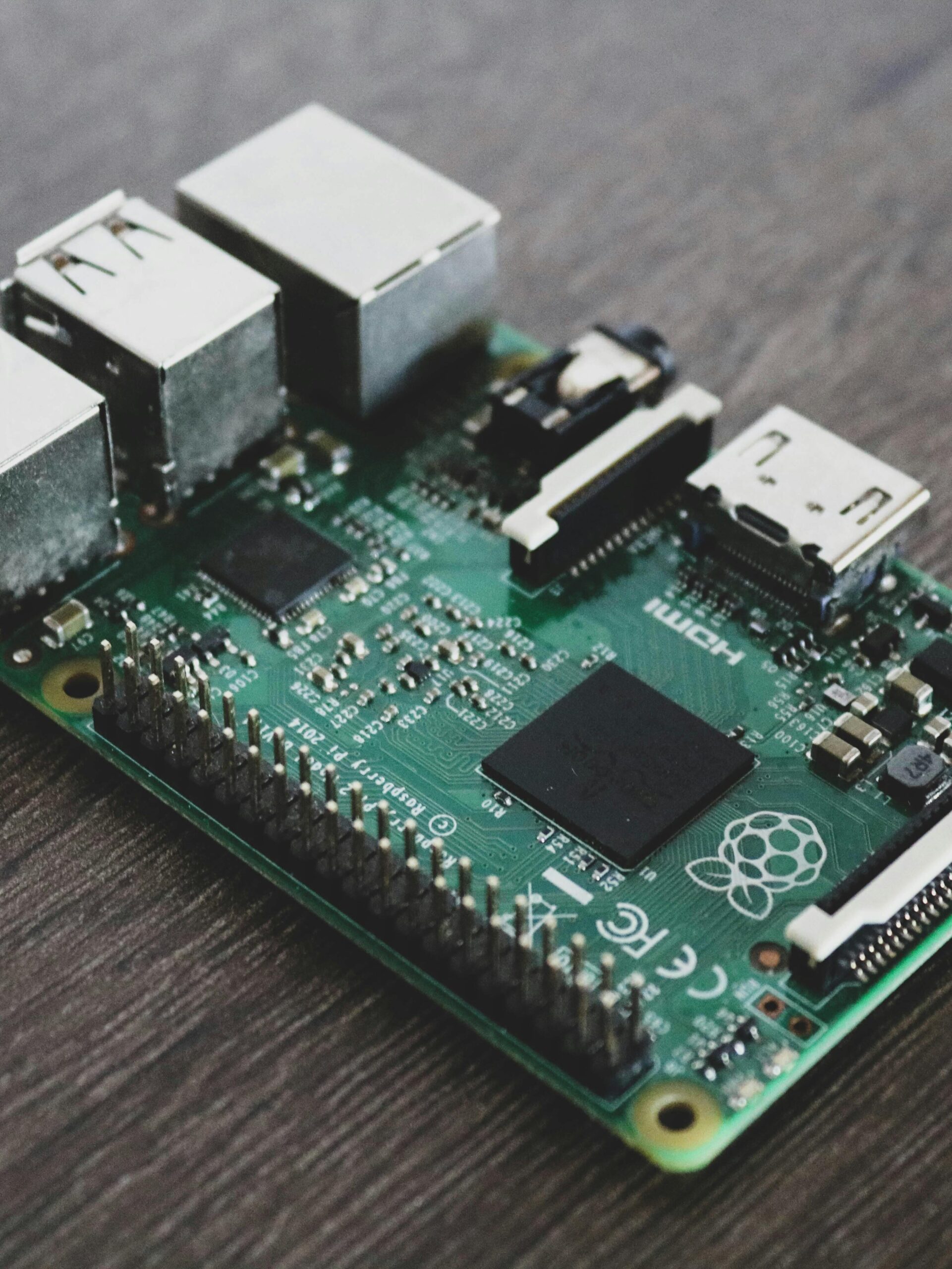 Detailed view of a Raspberry Pi circuit board with microchips and components.